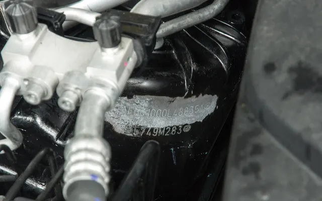 Tampered VIN stamped in an engine bay
